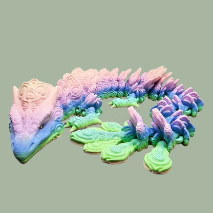 3D-printed Peacock Dragon figurine in pastel rainbow colours, featuring intricate feather-like scales and an articulated body. Handmade in the UK, available in medium, large, and X-large, with or without wings. A stunning, poseable dragon perfect for collectors and fantasy lovers