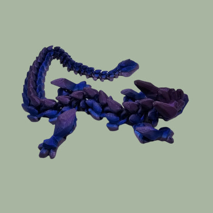 3D printed articulated dragon in a blue/purple colour