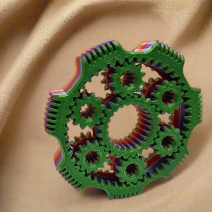 3D printed gear spinner fidget toy in multicolour filament with interlocking moving gears