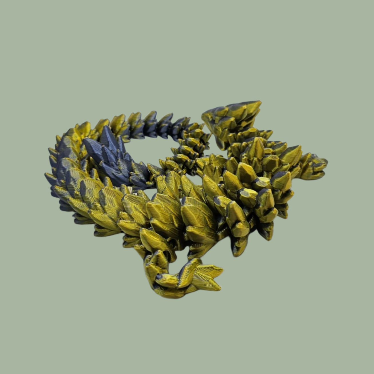 3D printed articulated dragon in a gold and blue colour