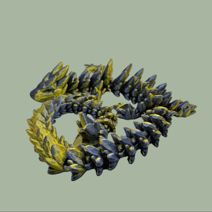 3D printed articulated dragon in a gold and blue colour