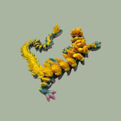 3D printed articulated dragon in a rainbow colour