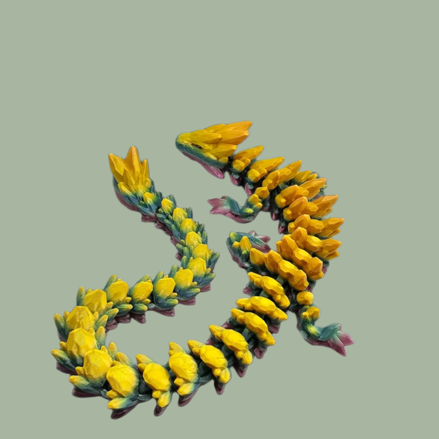 3D printed articulated dragon in a rainbow colour