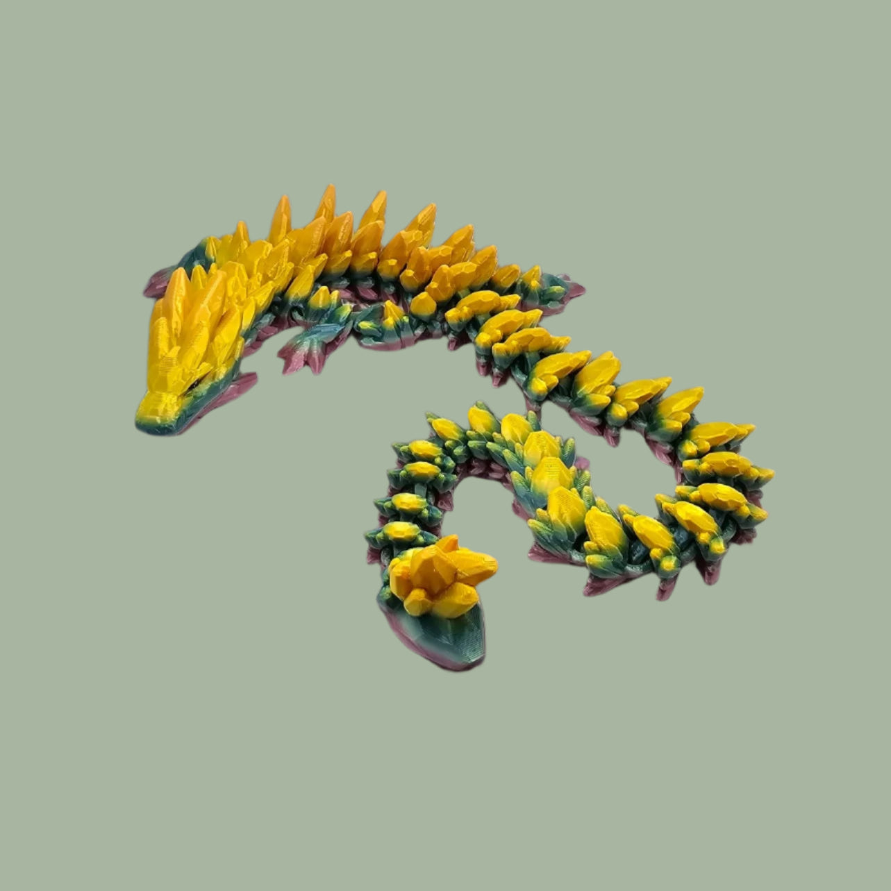 3D printed articulated dragon in a rainbow colour