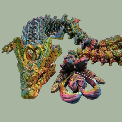 3D printed articulated dragon with heart details along the body and a spinning heart in the tail