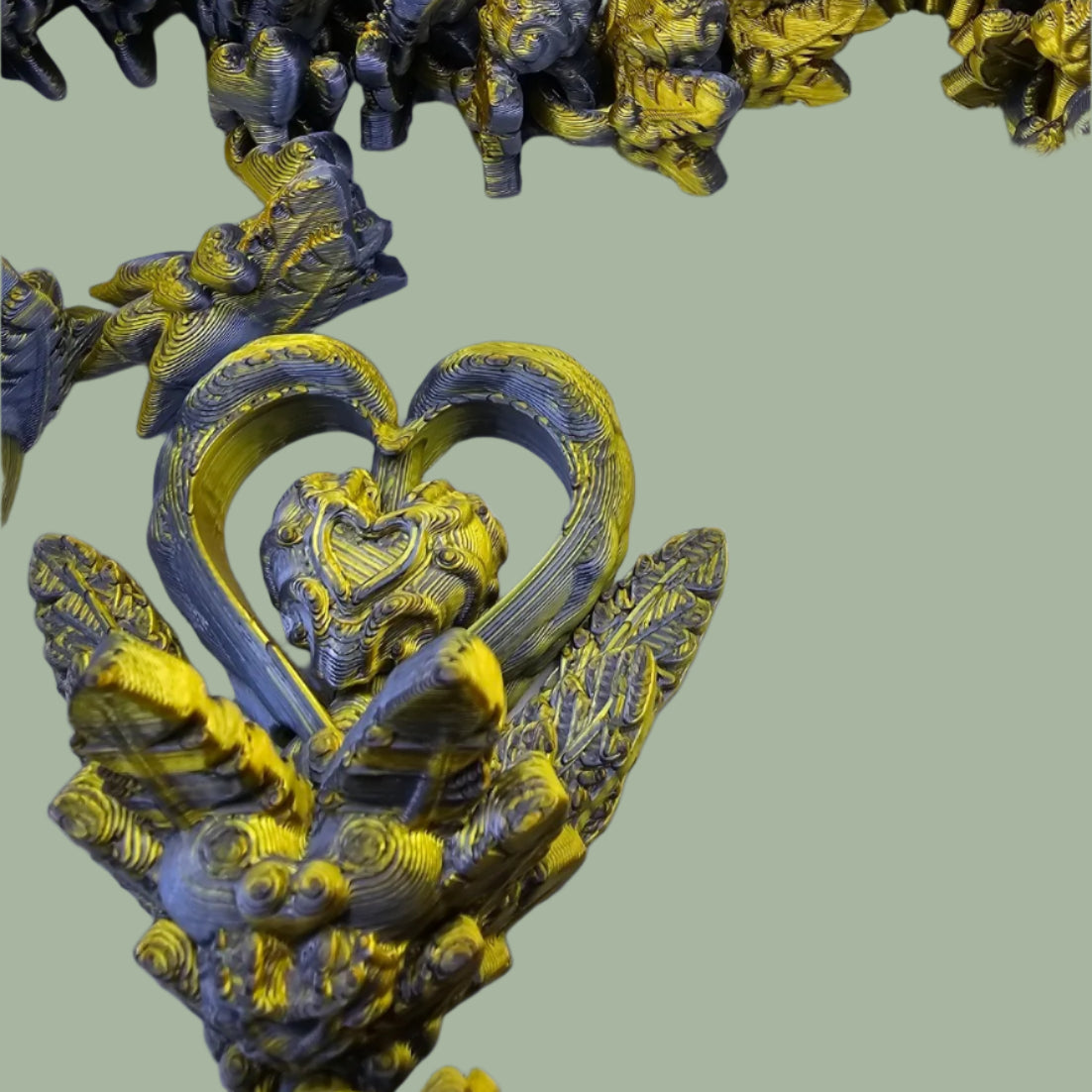 3D printed articulated dragon with heart details along the body and a spinning heart in the tail
