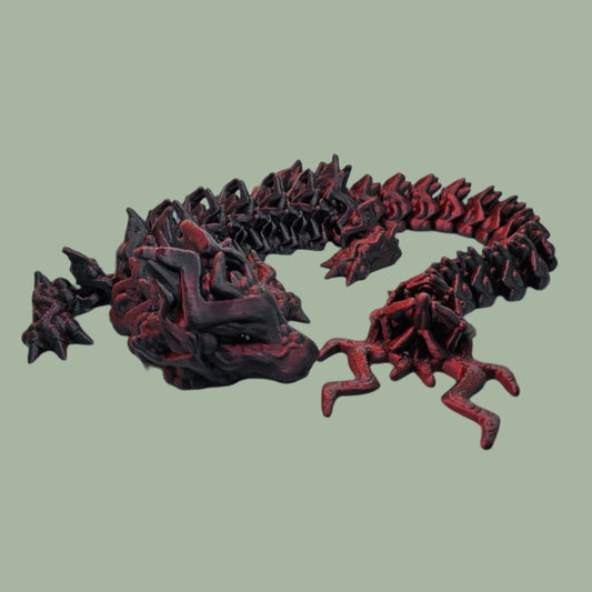 3D printed articulated dragon with lightening detail, in a red/black colour