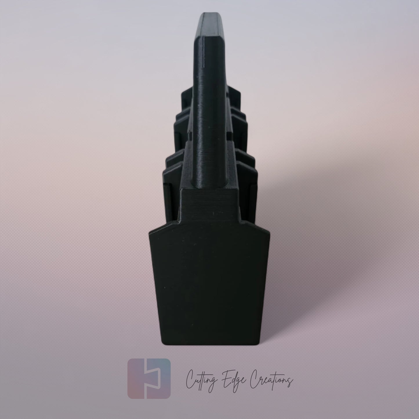 Black 3D printed battery caddy holding six Makita-compatible batteries with built-in carry handle