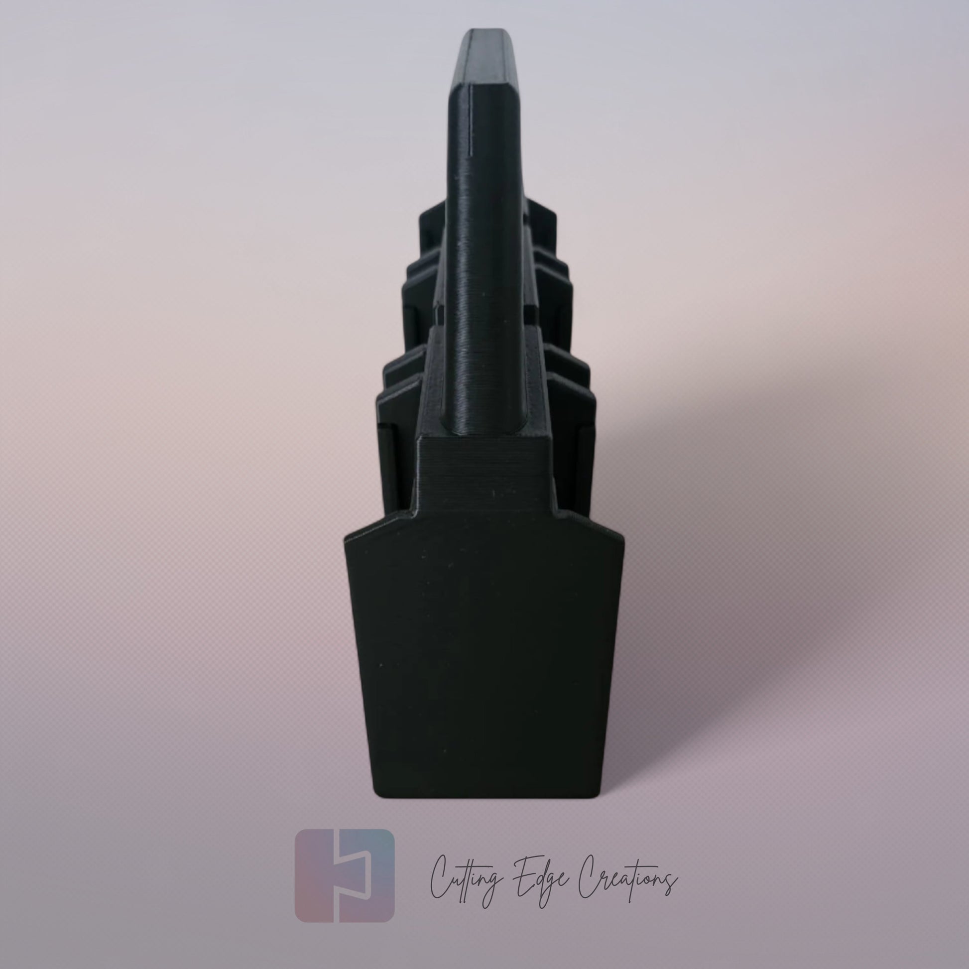 Black 3D printed battery caddy holding six Makita-compatible batteries with built-in carry handle