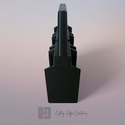 Black 3D printed battery caddy holding six Makita-compatible batteries with built-in carry handle