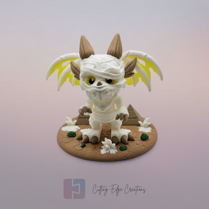 Mummy Dragon: “3D-printed Mummy Dragon figurine, articulated fidget toy with bandage design and display stand, handmade in the UK