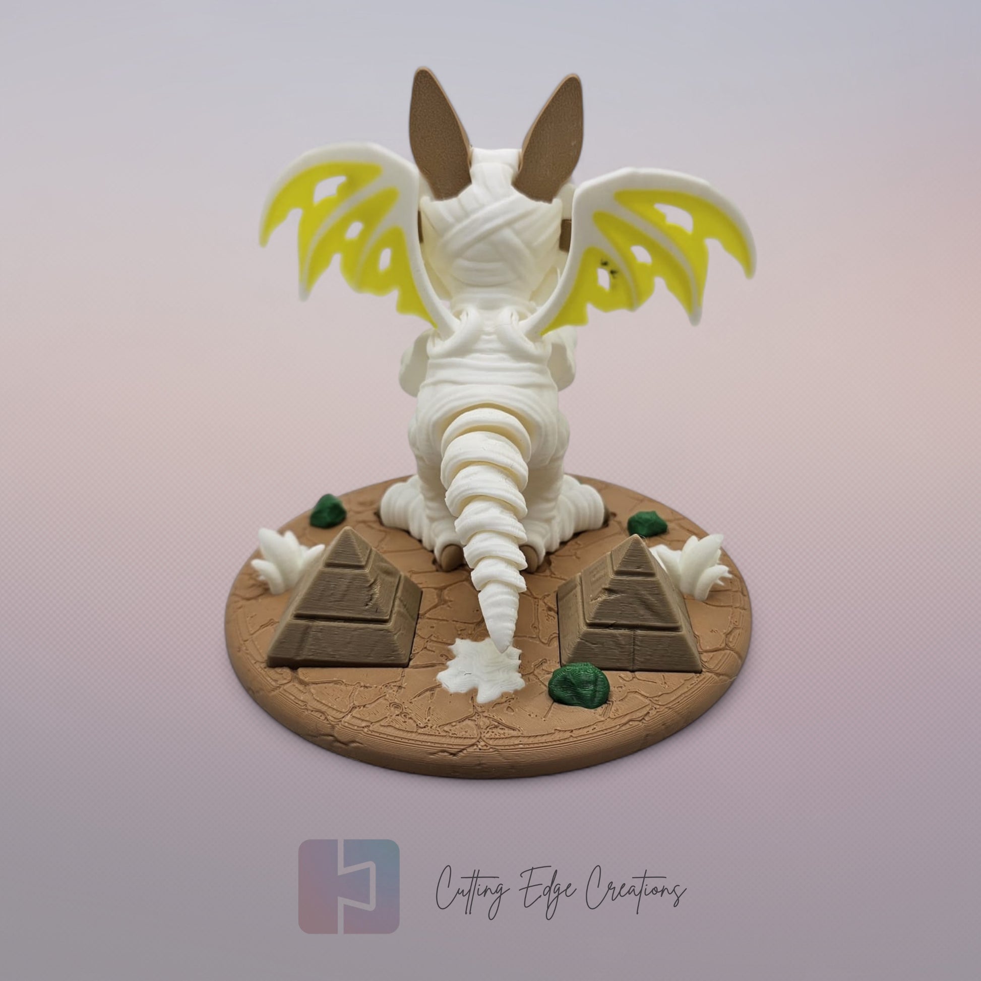 Mummy Dragon: “3D-printed Mummy Dragon figurine, articulated fidget toy with bandage design and display stand, handmade in the UK