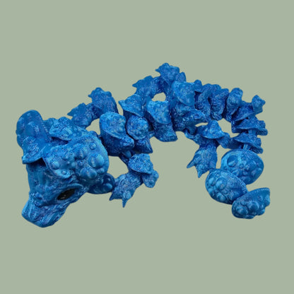 3D printed articulated dragon with mushroom details along the body