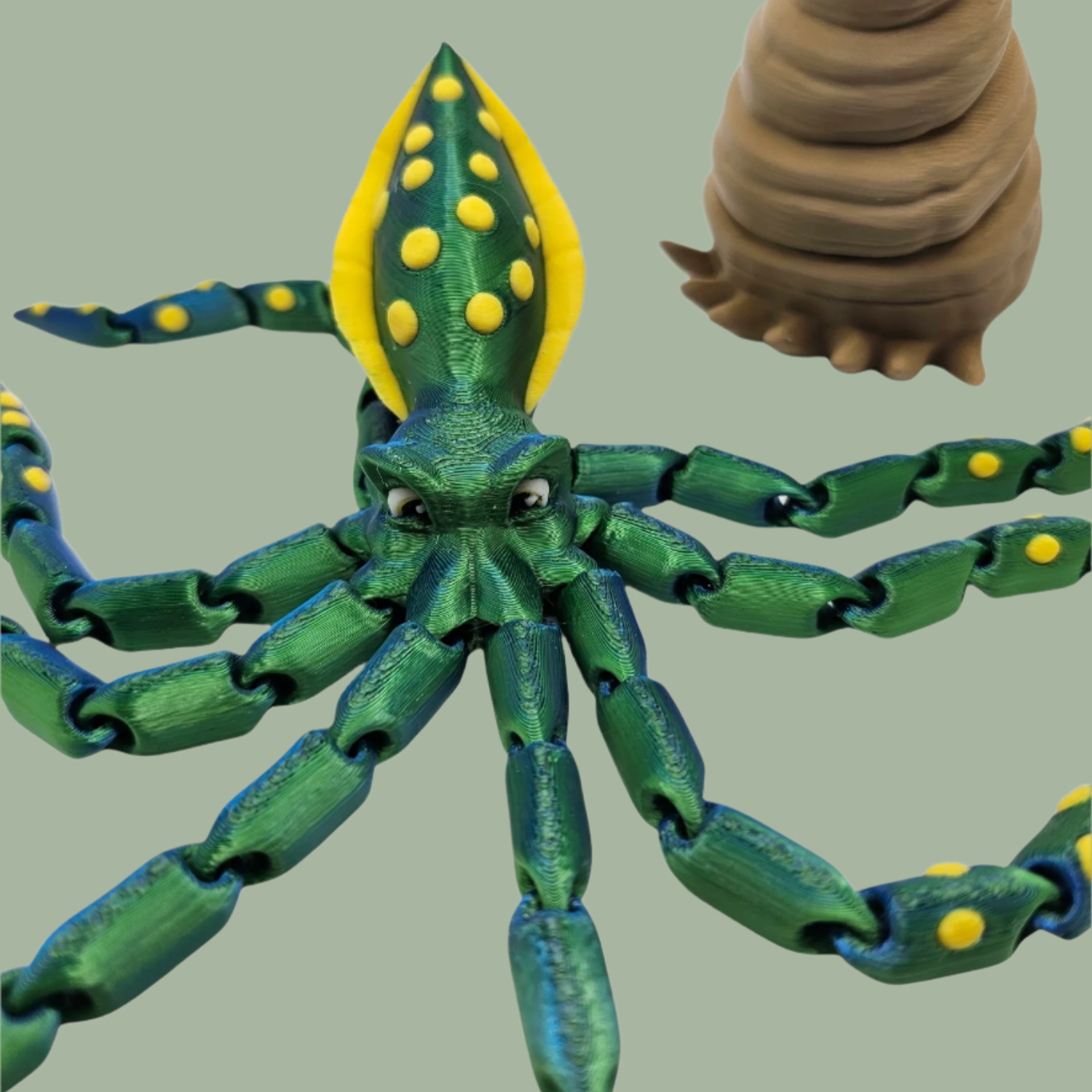 3D printed articulated green octopus with yellow spots and removeable shell hat