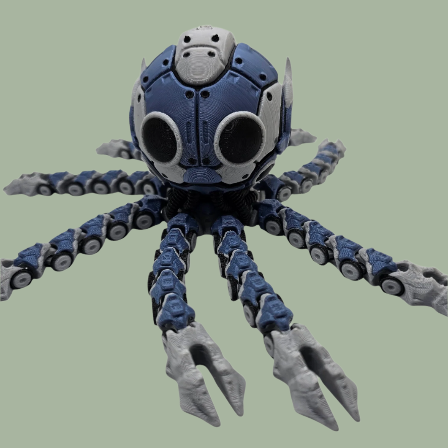 3D printed cyber octopus in blue, white, black, and grey, with an openable face revealing a hamster driving the machine