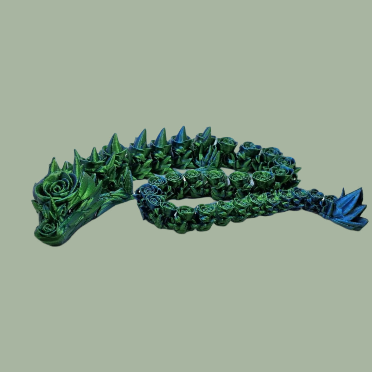 3D printed articulated dragon with rose details along the body