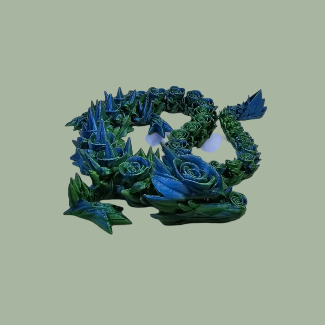 3D printed articulated dragon with rose details along the body