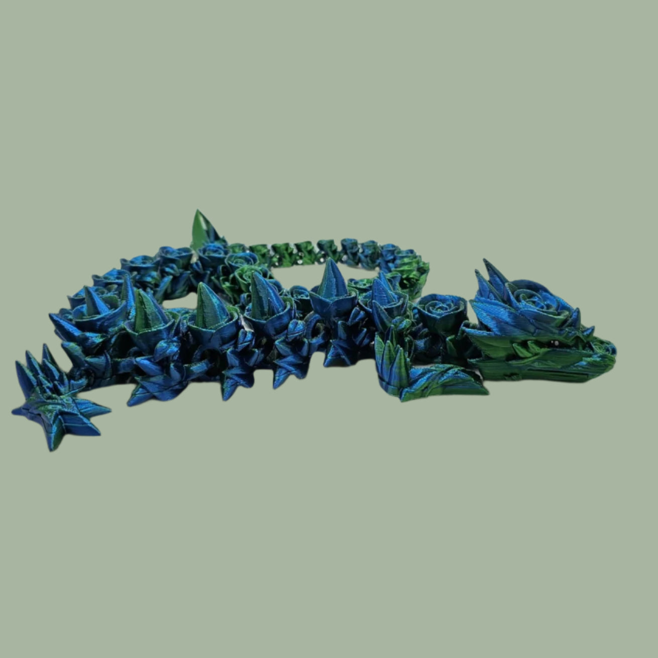 3D printed articulated dragon with rose details along the body