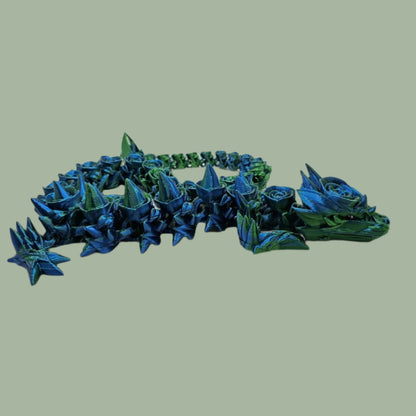 3D printed articulated dragon with rose details along the body