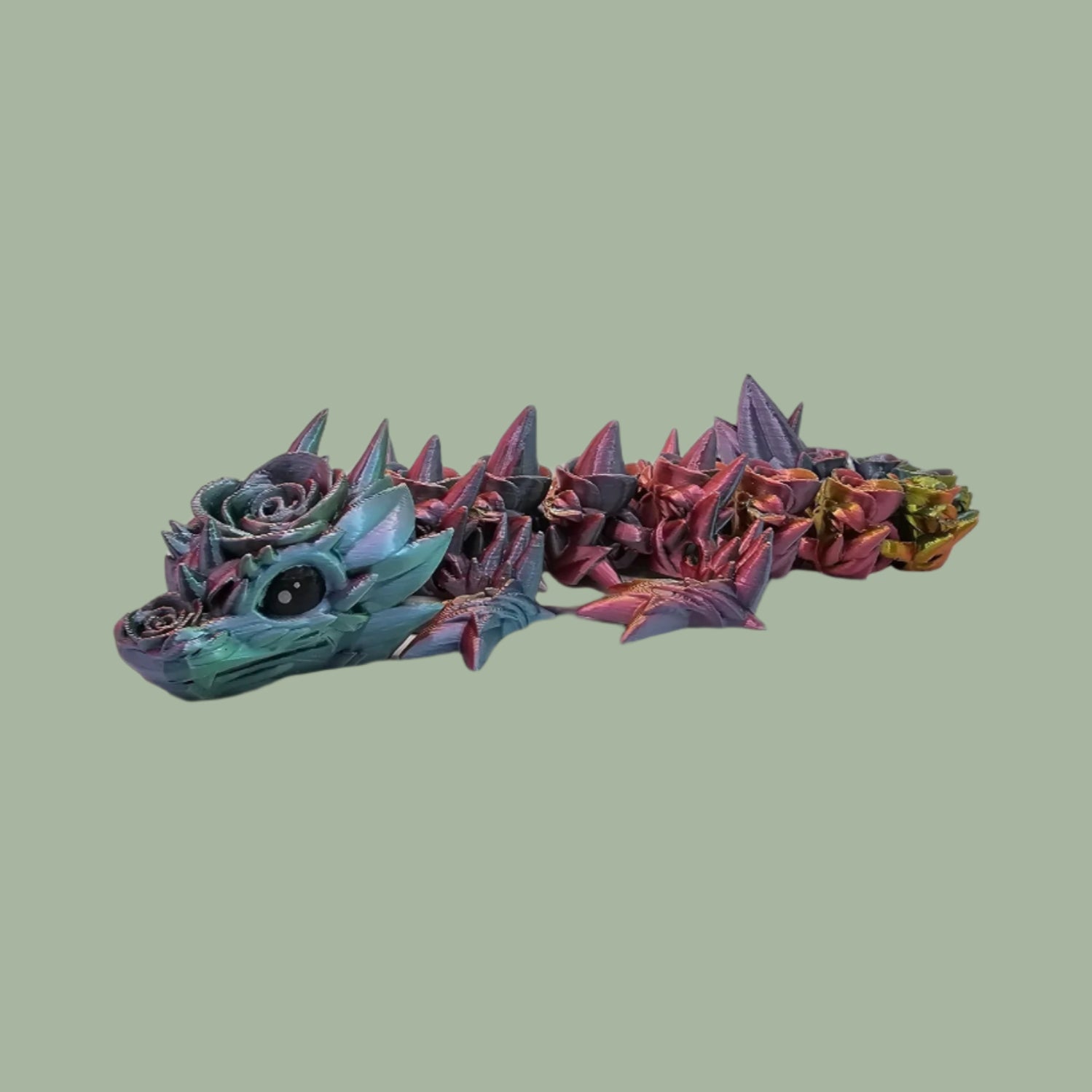 3D printed articulated dragon with rose details along the body
