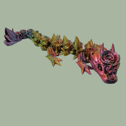 3D printed articulated dragon with rose details along the body