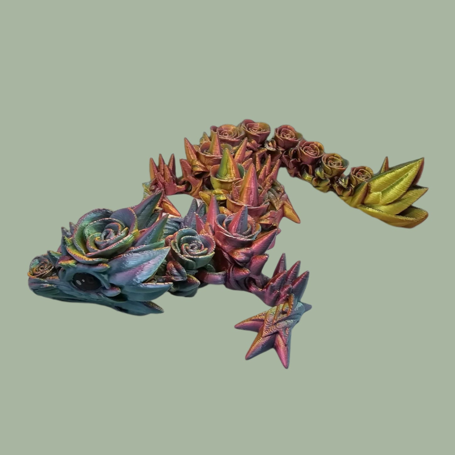 3D printed articulated dragon with rose details along the body