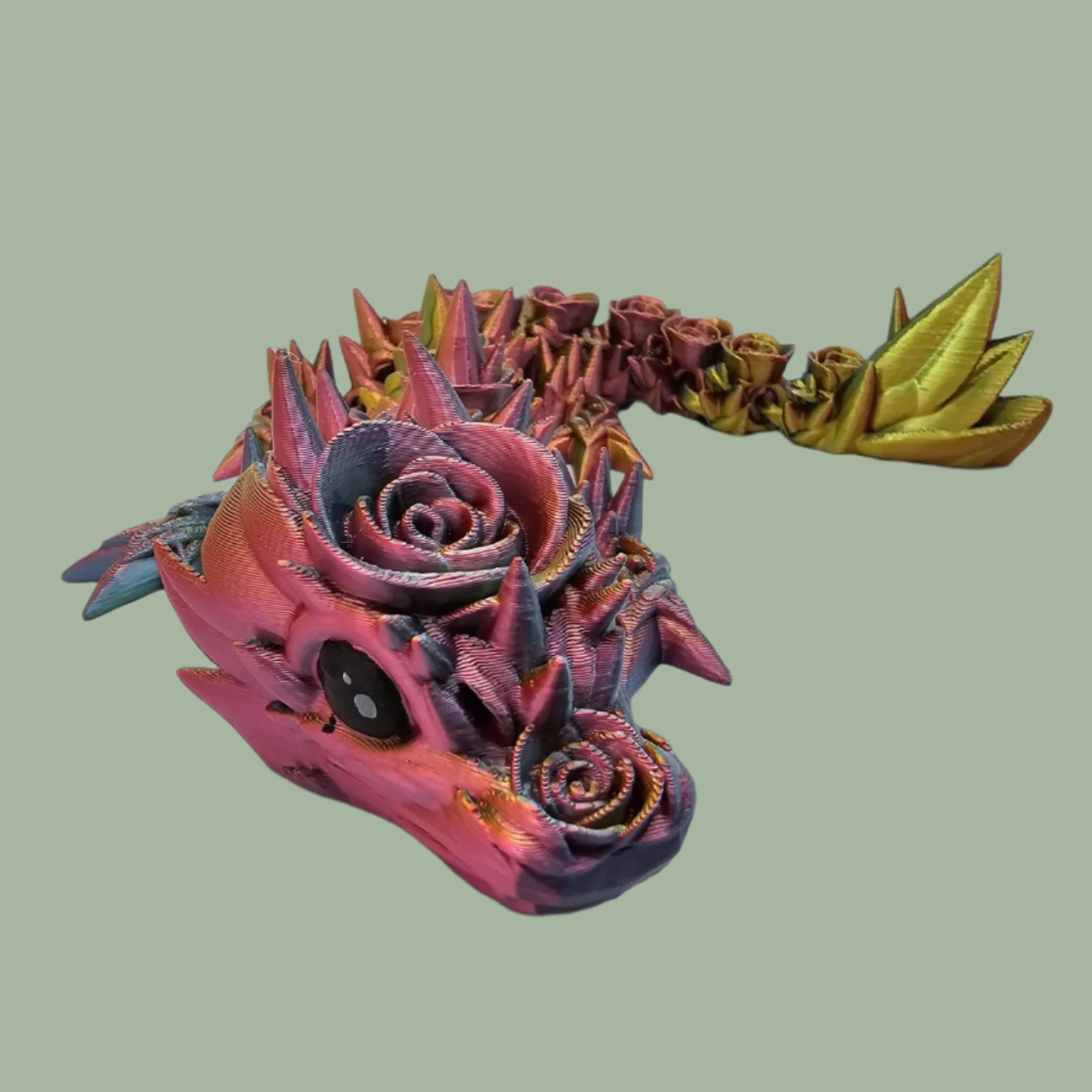 3D printed articulated dragon with rose details along the body