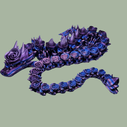 3D printed articulated dragon with rose details along the body