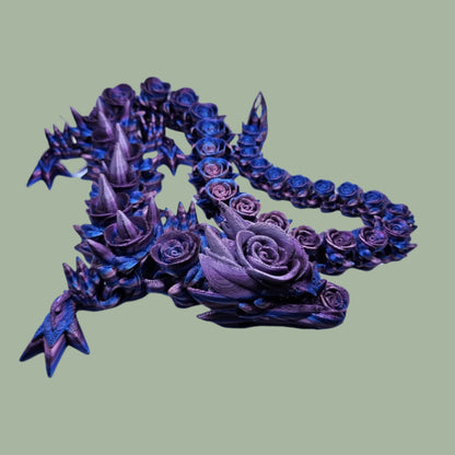 3D printed articulated dragon with rose details along the body