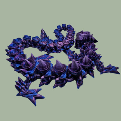 3D printed articulated dragon with rose details along the body