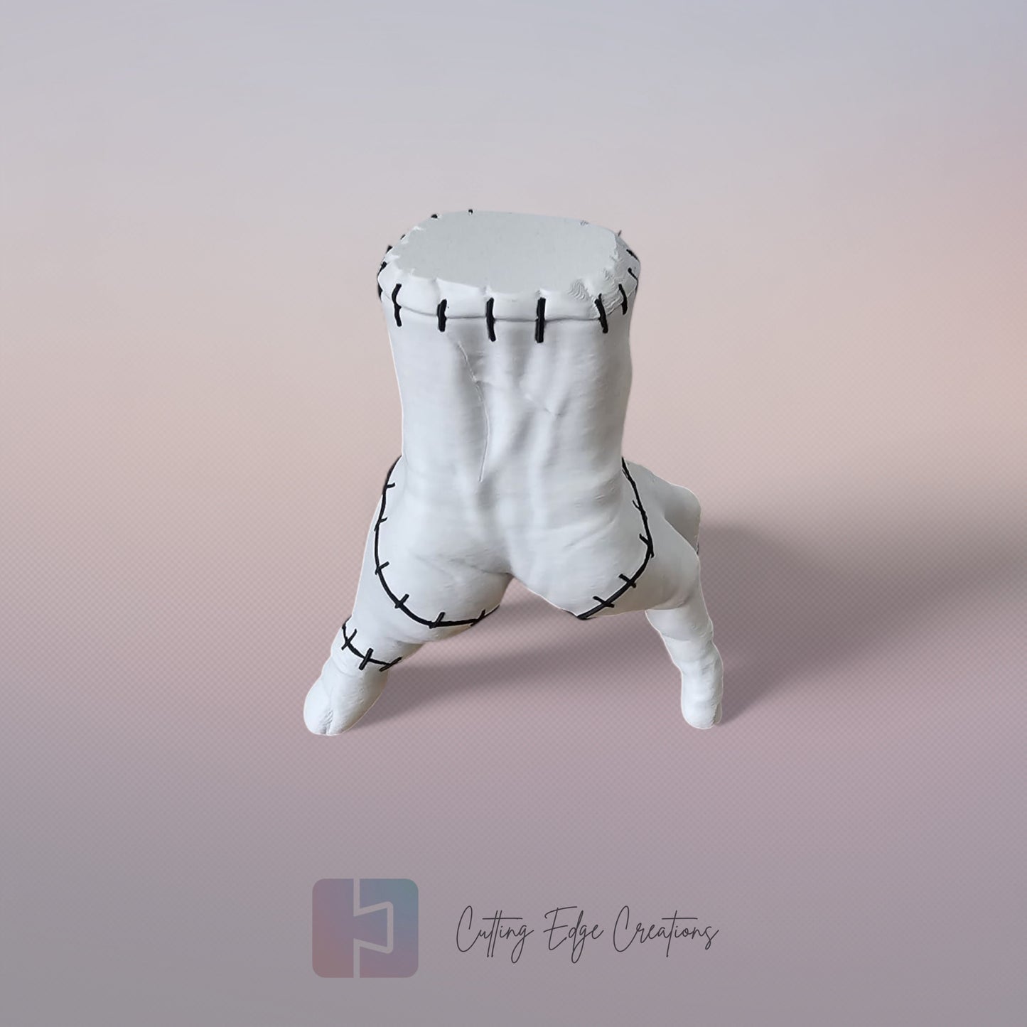 Close-up of white 3D printed stitched hand model, creepy Addams Family style ornament