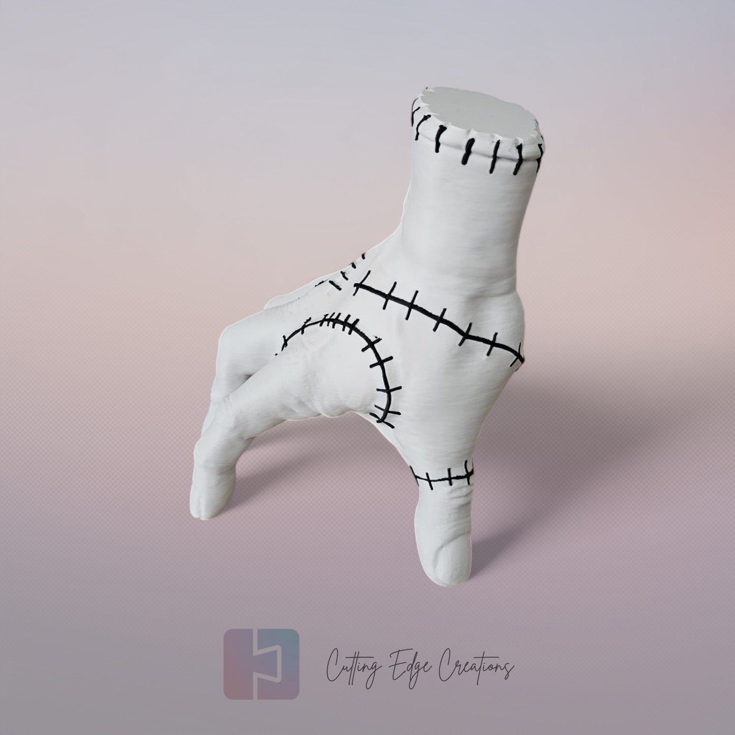 Close-up of white 3D printed stitched hand model, creepy Addams Family style ornament