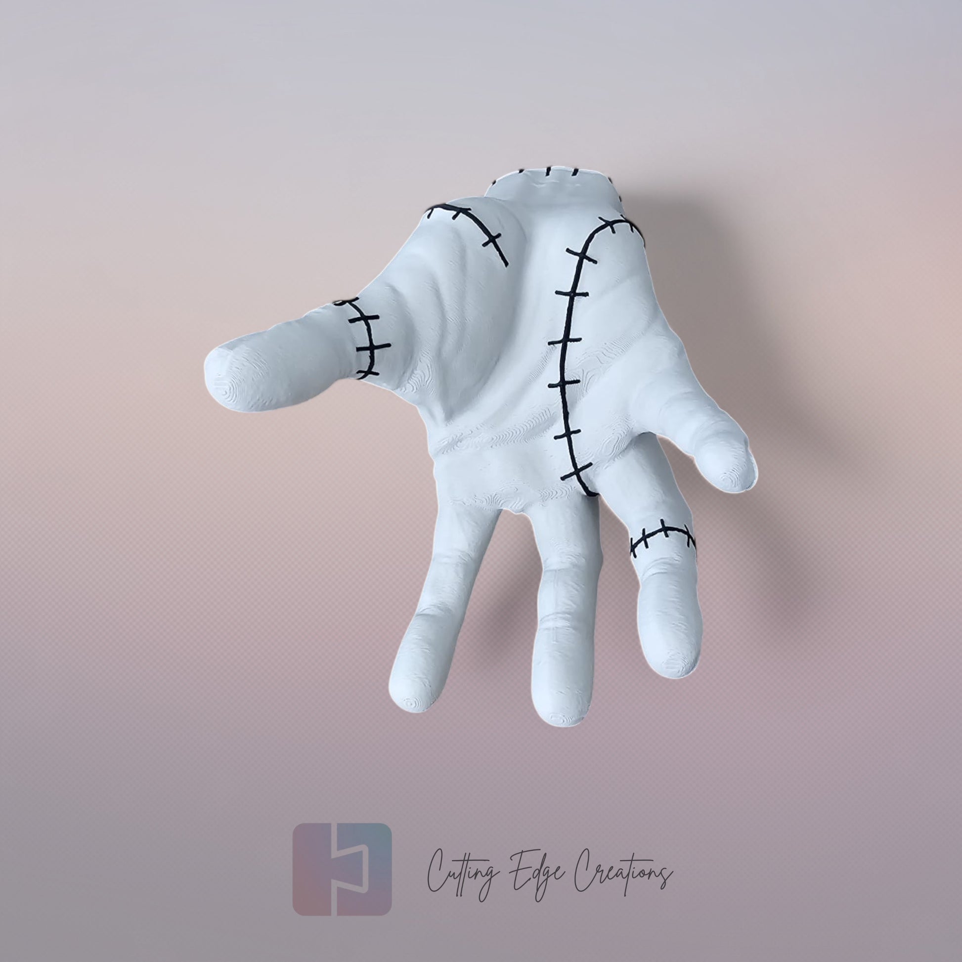 Close-up of white 3D printed stitched hand model, creepy Addams Family style ornament
