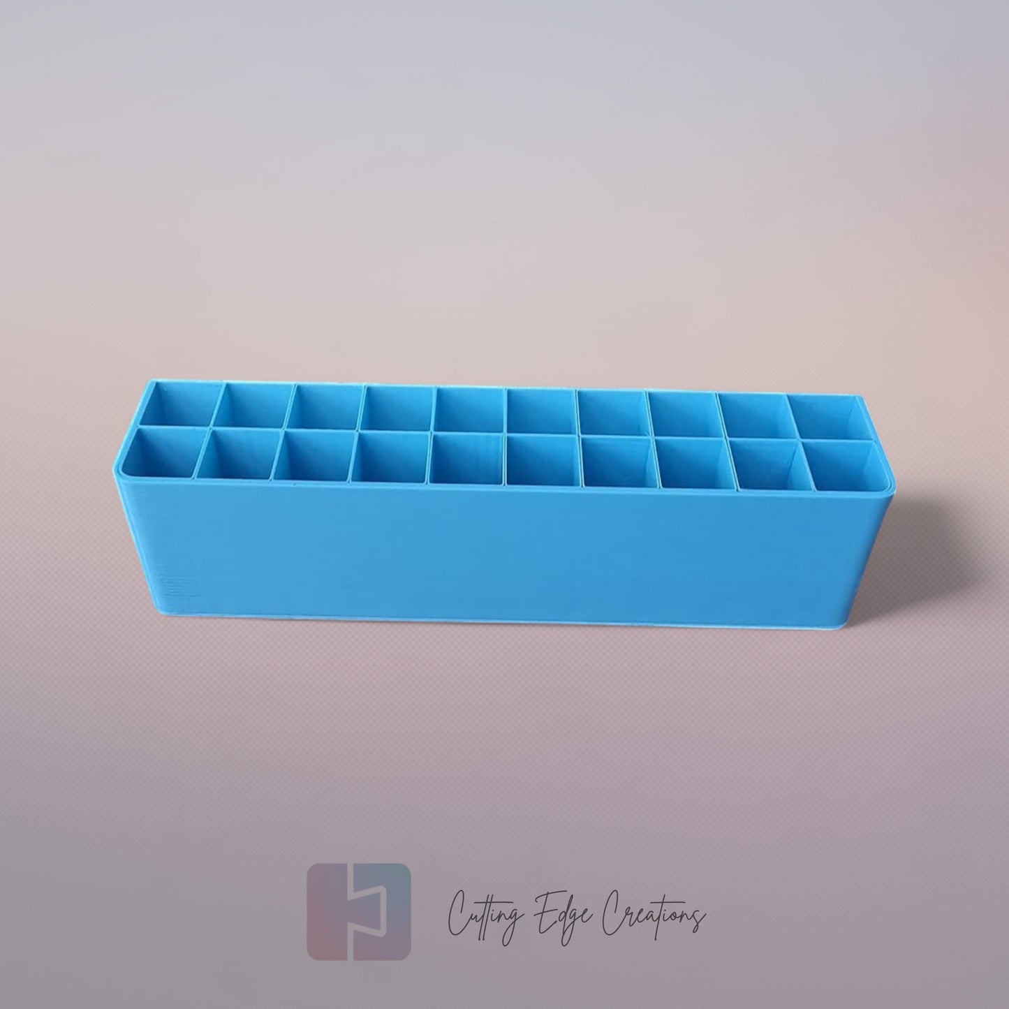 3D printed blending marker and pen stand holding colourful markers and lids on a tidy artist’s desk