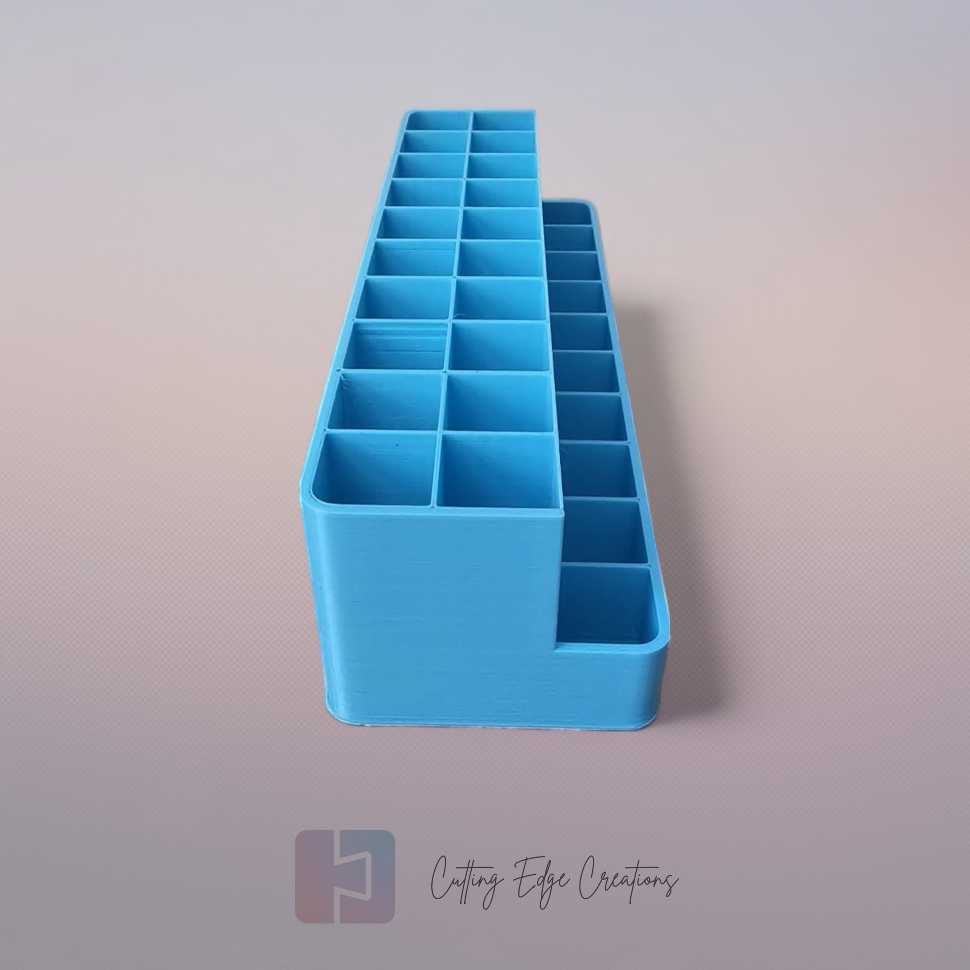 3D printed blending marker and pen stand holding colourful markers and lids on a tidy artist’s desk