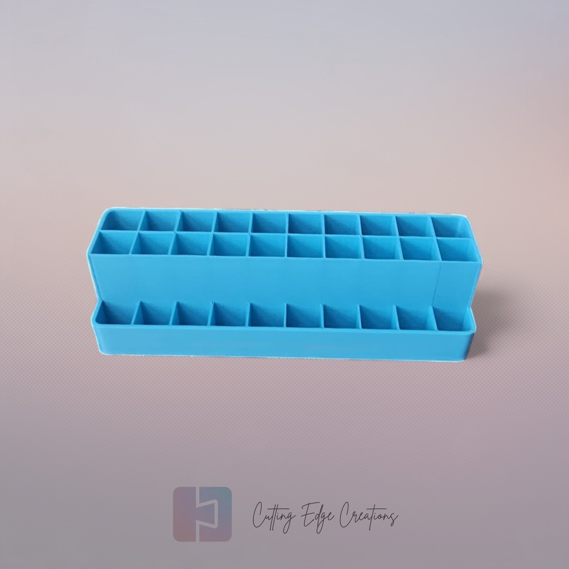 3D printed blending marker and pen stand holding colourful markers and lids on a tidy artist’s desk