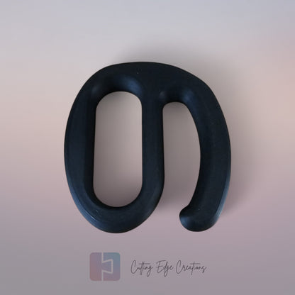 A strong black plastic handle holding multiple Aldi shopping bags in one hand against a white background.