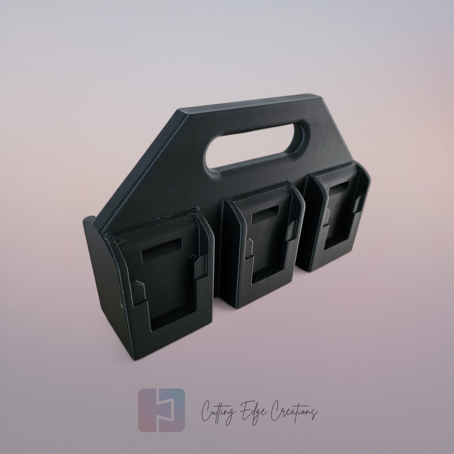 Black 3D printed battery caddy compatible with DeWalt batteries holding six batteries on wooden workbench in workshop.