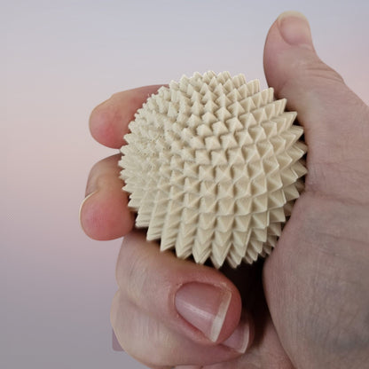 Cutting Edge Creations beige 5cm textured polymer Spike Sphere fidget toy with micro-spikes.