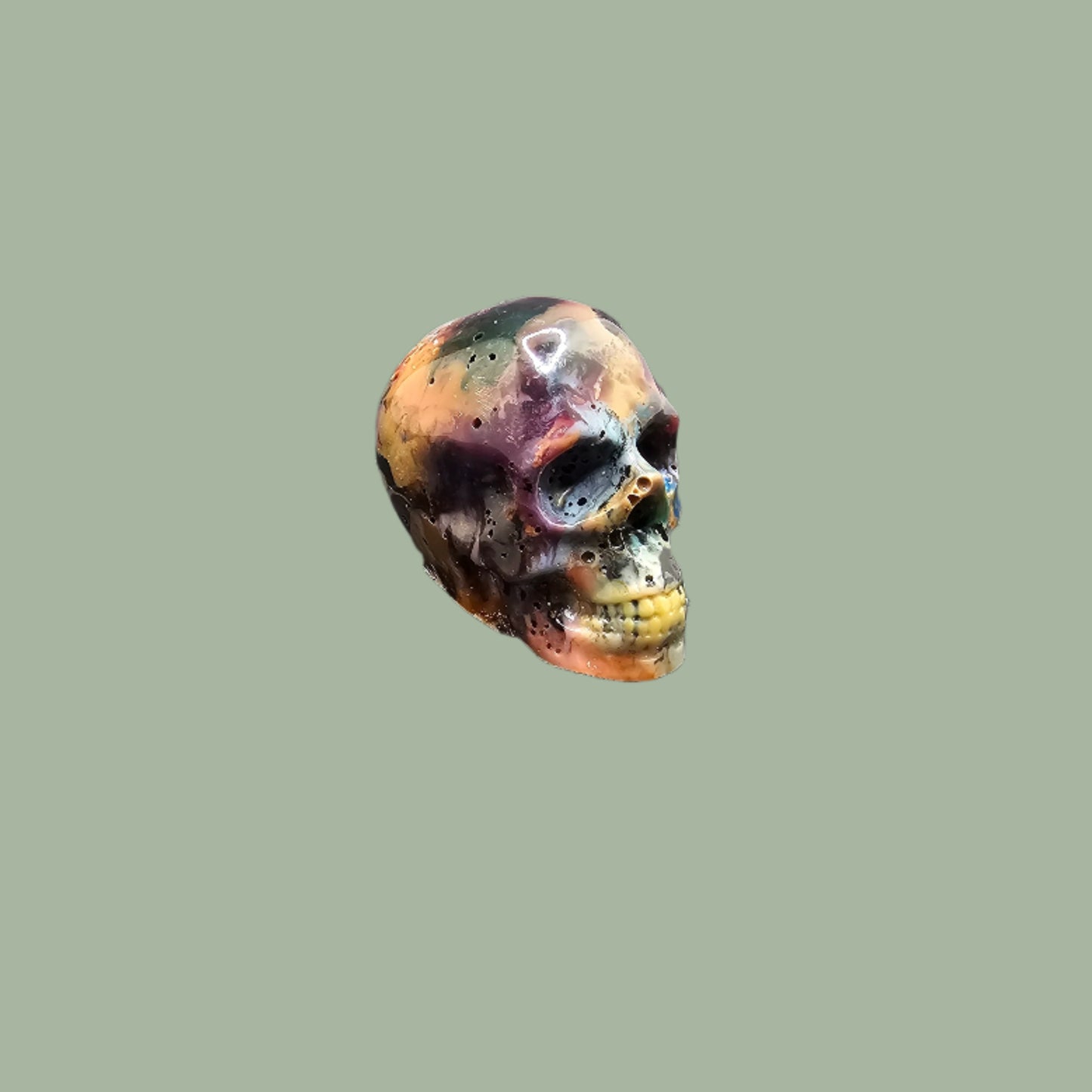 Colourful recycled filament skulls in large, medium, and small sizes, made from 3D printing waste. Each skull is unique, featuring a mix of random colours. Eco-friendly and sustainable home decor
