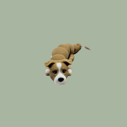 3D printed light brown and white articulated dog keychain with folded ears