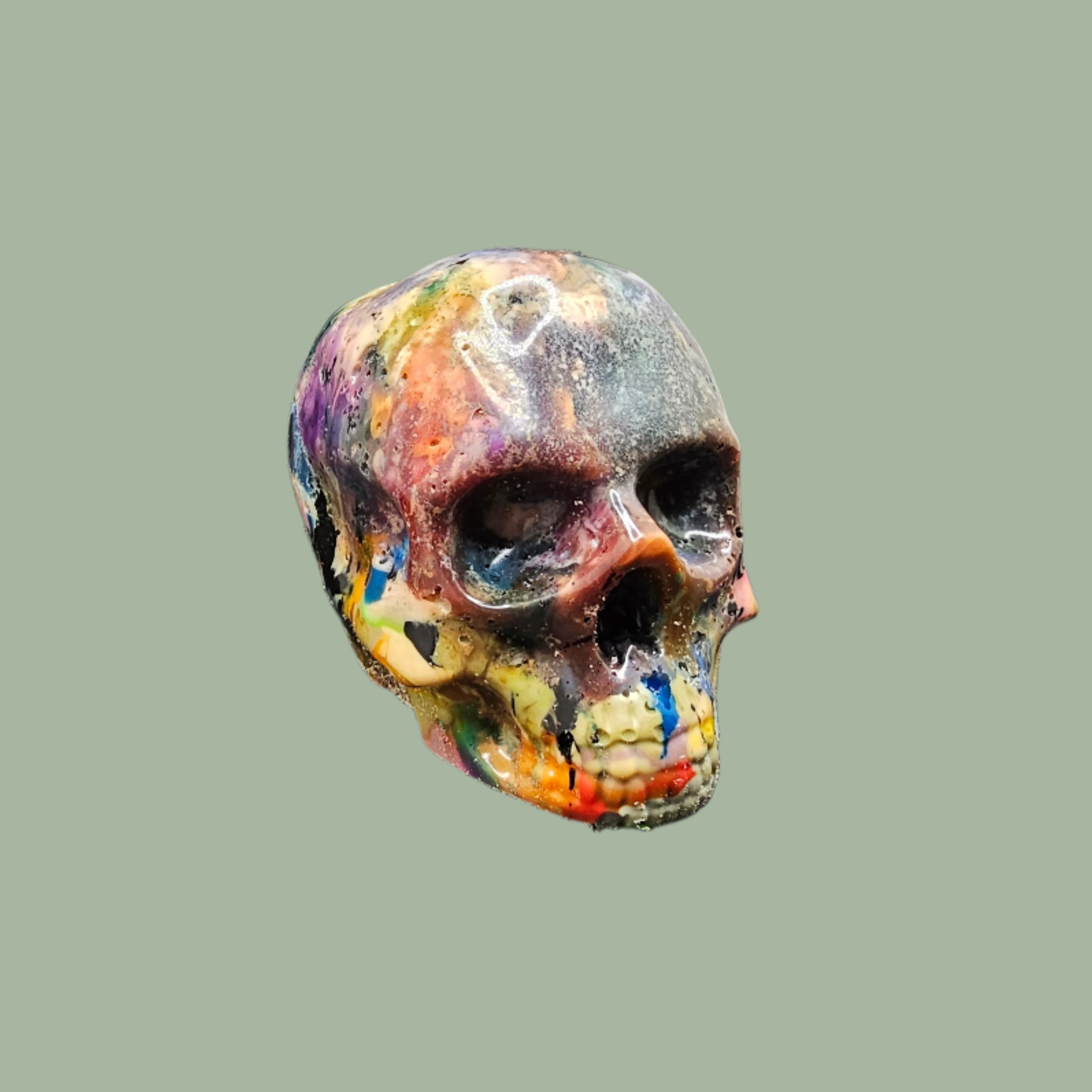 Colourful recycled filament skulls in large, medium, and small sizes, made from 3D printing waste. Each skull is unique, featuring a mix of random colours. Eco-friendly and sustainable home decor