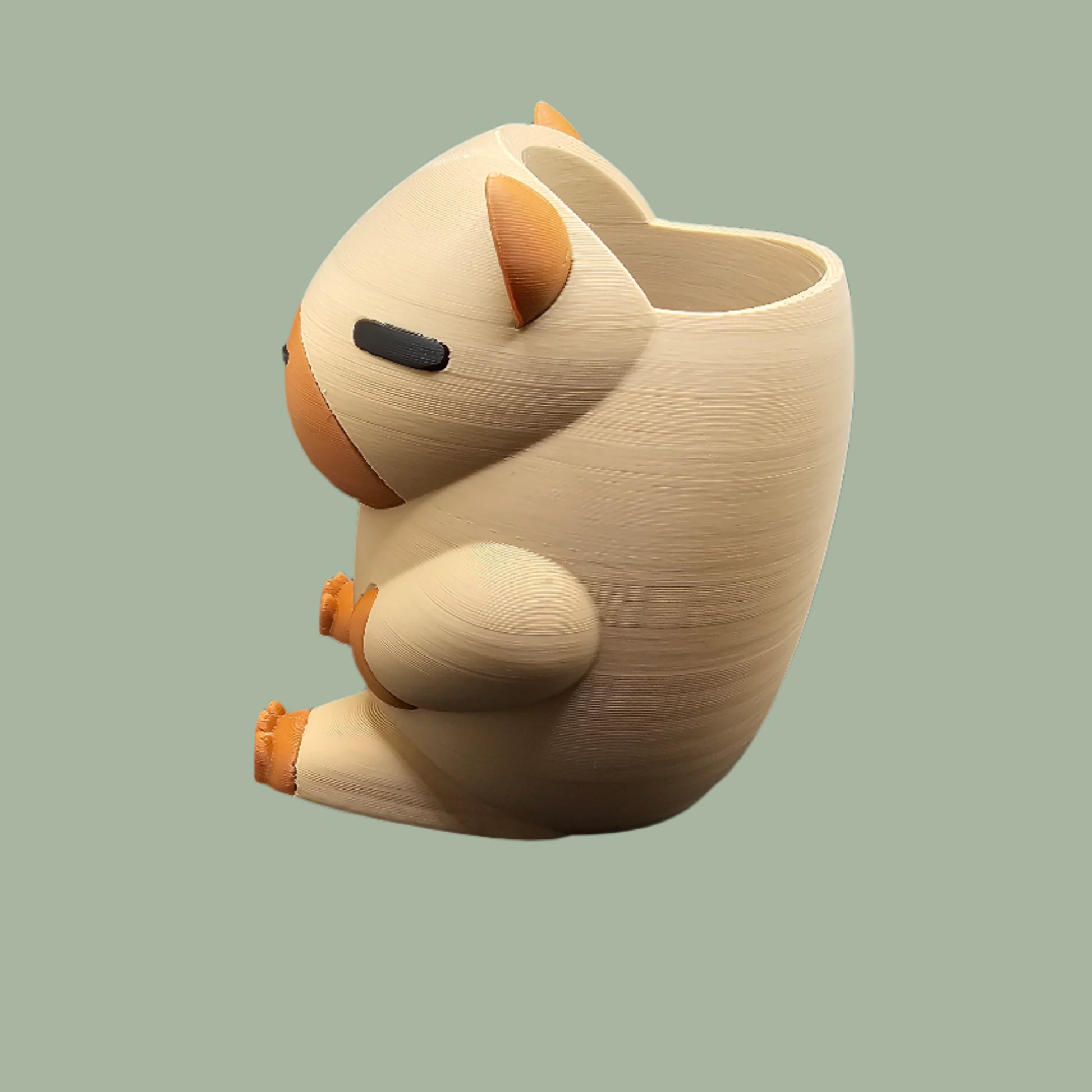 3D printed Capybara Pen Pot in a cute cartoon style, holding pens upright. A fun and functional desk organiser, designed and made in the UK. Perfect for stationery storage and office decor