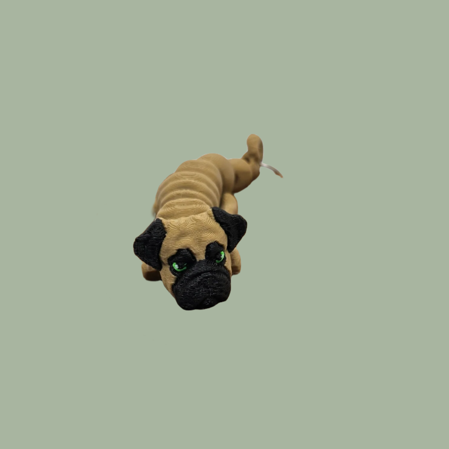 Light brown and black articulated dog keyring with green eyes