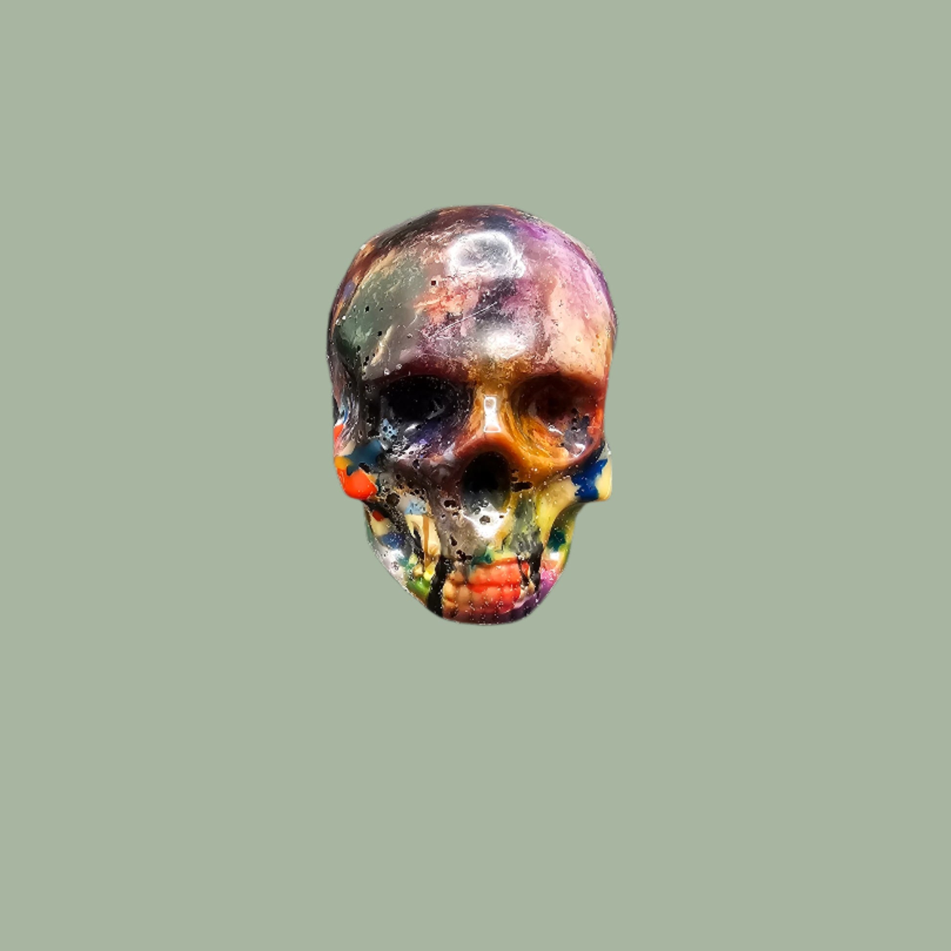 Colourful recycled filament skulls in large, medium, and small sizes, made from 3D printing waste. Each skull is unique, featuring a mix of random colours. Eco-friendly and sustainable home decor