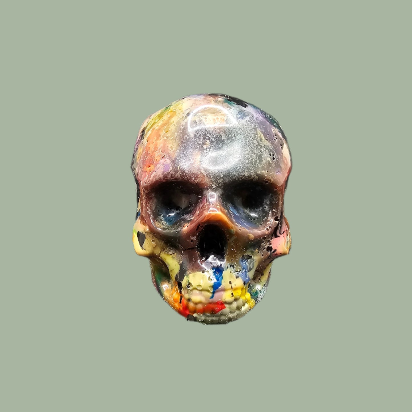 Colourful recycled filament skulls in large, medium, and small sizes, made from 3D printing waste. Each skull is unique, featuring a mix of random colours. Eco-friendly and sustainable home decor