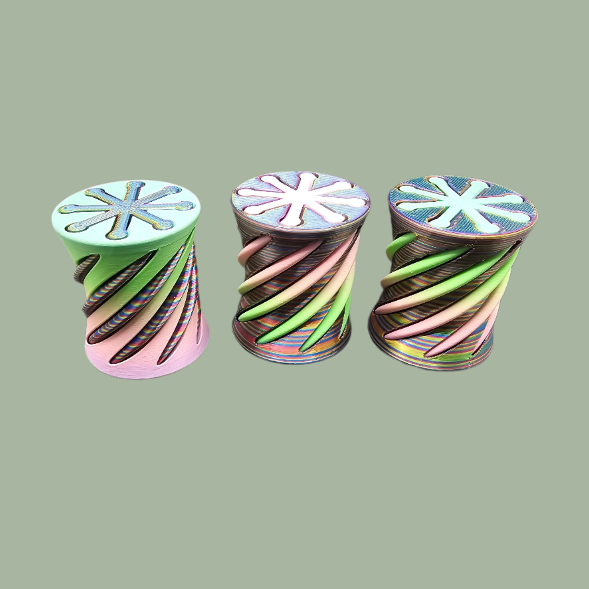 3D-printed Infinity Tubes in pastel and rainbow colours, featuring a spiral fidget design. Small, portable sensory toy made in the UK for stress relief and endless fidgeting