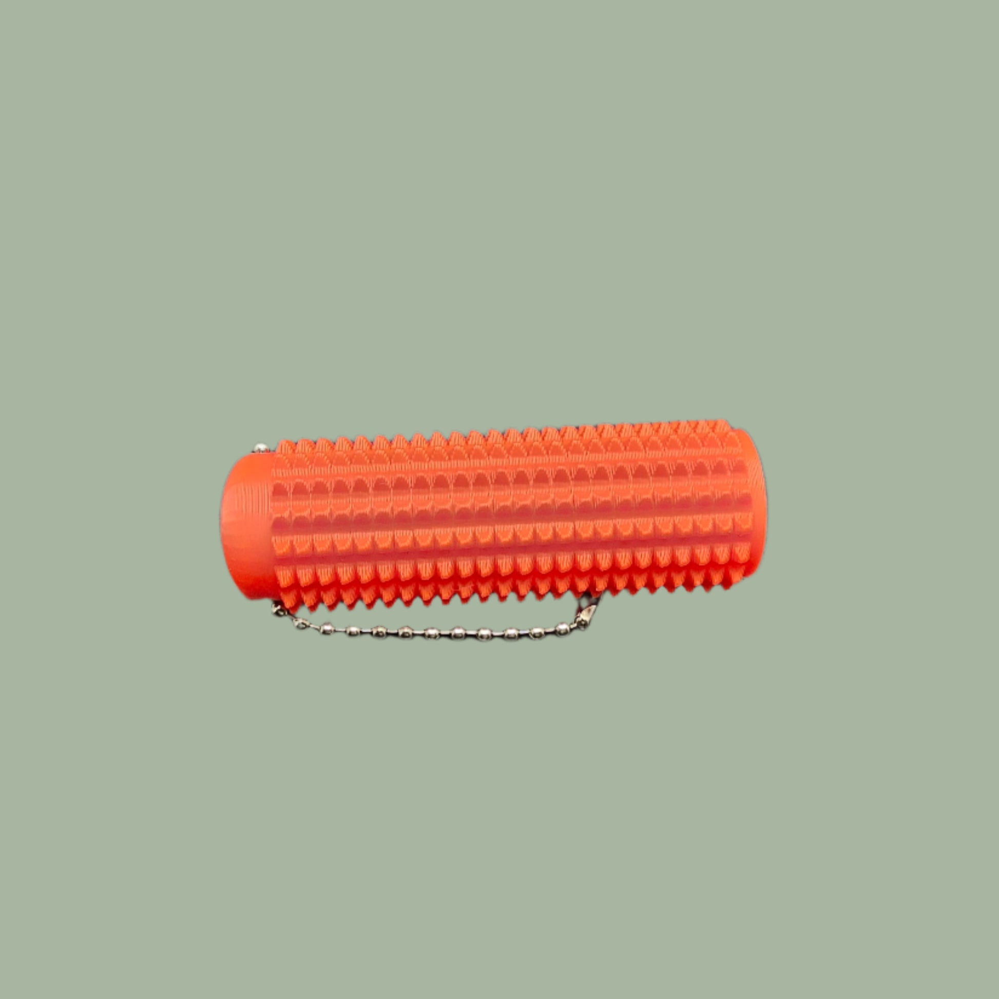 Mini Ouchie Pain Stim – a 7cm long, 3D-printed sensory tool with textured spikes for tactile stimulation, displayed against a neutral background. Includes a keychain for easy portability