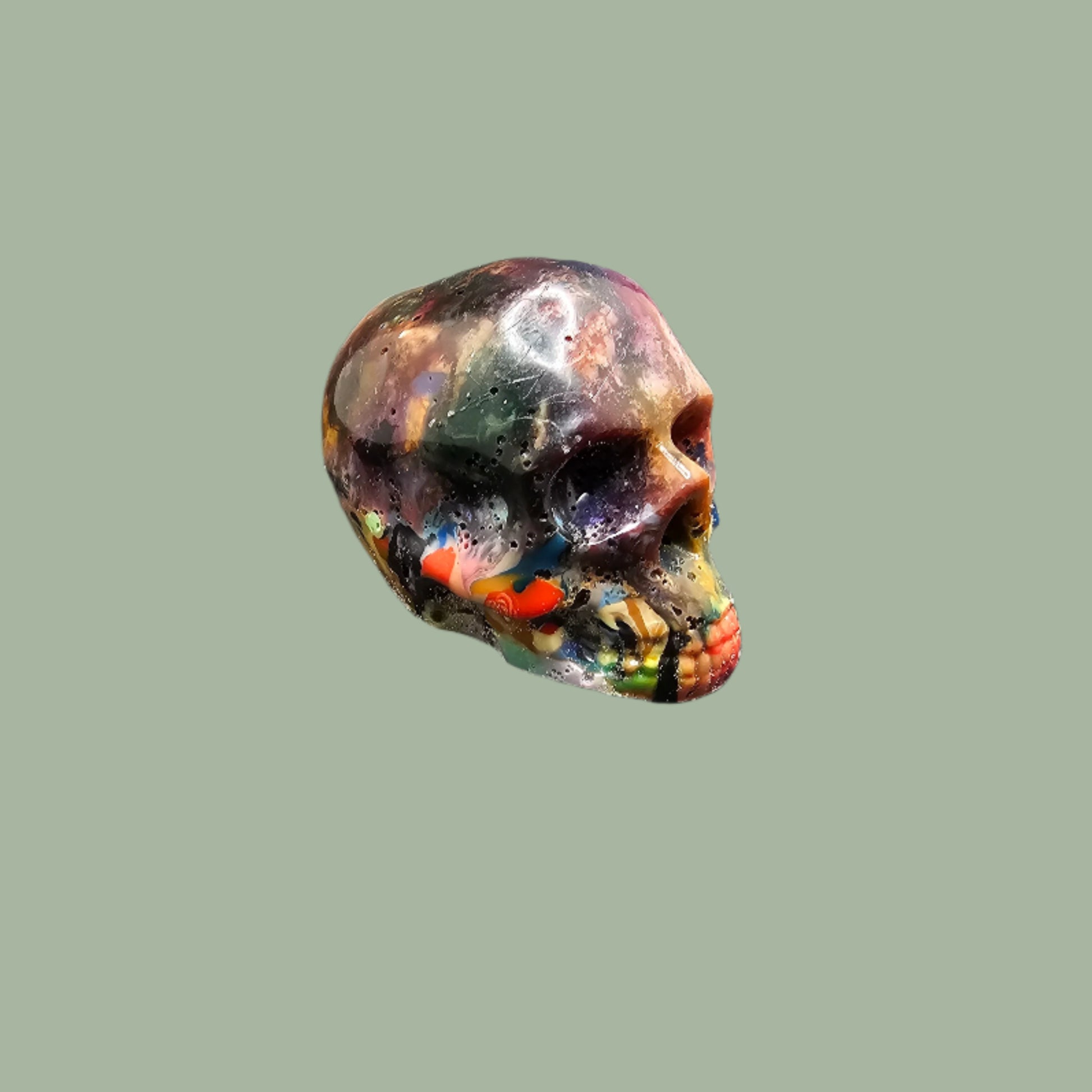 Colourful recycled filament skulls in large, medium, and small sizes, made from 3D printing waste. Each skull is unique, featuring a mix of random colours. Eco-friendly and sustainable home decor