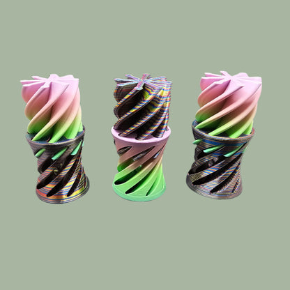 3D-printed Infinity Tubes in pastel and rainbow colours, featuring a spiral fidget design. Small, portable sensory toy made in the UK for stress relief and endless fidgeting
